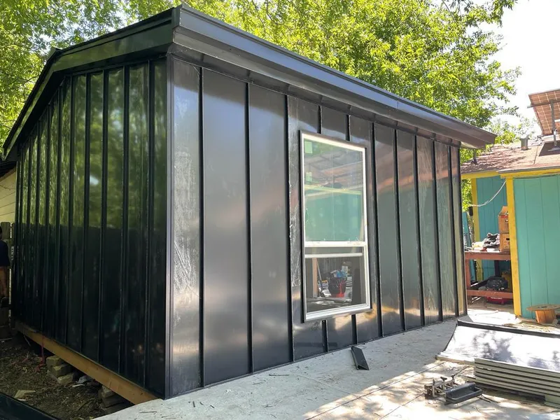 Black standing seam metal wall panels for Roof Inspection in Sheldon